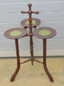 An unusual triform 'guinea' tray Lazy Susan type table having spindle turned and gadrooned