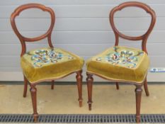 A good pair of mahogany framed hall or bedroom chairs, each raised over reeded tapering legs.