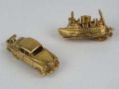 Two 9ct gold charms; one being a ship opening to reveal 'cars' within,