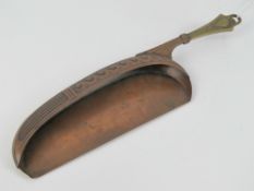 An Art Nouveau WMF crumb scoop made of copper and brass, marked with stamp verso.