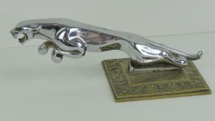 A chrome Jaguar car bonnet mascot in the form of a leaping jaguar, 7 1/2
