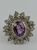 A large and impressive 18ct gold diamond and amethyst cocktail or 'Knuckle Duster' ring.