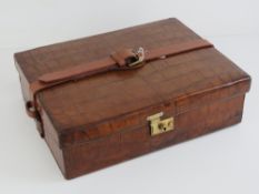 An Asprey of London crocodile skin ladies travelling companion case,