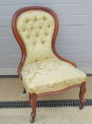 A good mahogany framed button back over-stuffed drawing room chair,