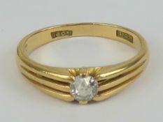 An 18ct gold and diamond solitaire ring, the round cut brilliant diamond approx 0.