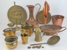 A quantity of assorted brass and copper wares including balance scales, jug, mortar and pestle, etc.