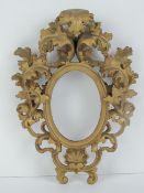 Florentine gilt miniature frame: a 19th century carved wooden and gilded frame with scallop shell