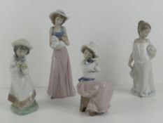 Four assorted Nao figurines, 16-26cm.