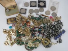 A quantity of assorted costume jewellery and commemorative coins.