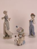 Three assorted Lladro figurines, 15-25cm high, fingers a/f.