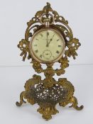 Pocket watch and stand: a Dennison gold plated top wind pocket watch, with seconds dial at 6.