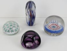 A large millefiori glass paperweight possibly by Whitefriars with red and blue canes, 9cm diameter,