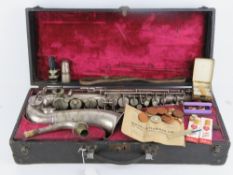 Saxophone; an old silver plated ALTO Saxophone musical instrument made by Savanna,