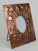 Arts and Crafts: a 19 th century copper easel photograph frame with chased decoration depicting