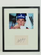 Ayrton Senna; hand-signed autograph on card in photographic montage. Measuring 36 x 30cm.
