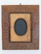 Arts and Crafts frame 'SLL 1889': a highly carved Teak frame decorated with birds amongst pine,