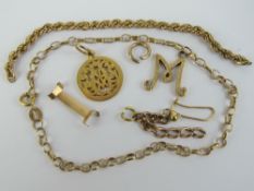 A quantity of yellow metal items including initialled charm engraved 7 July 1887, 2.6g, 'M' charm 1.