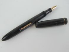 A vintage Mabie Todd 'self-filler' Blackbird fountain pen with 14ct gold Blackbird MT & Co Ltd nib.