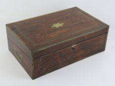 A fine quality 19th century rosewood writing slope lid lifting to reveal baise top slope having