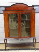 An Edwardian mahogany bow fronted display cabinet,