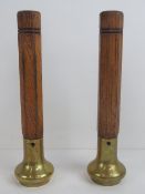 Two original brass and oak beer pump han