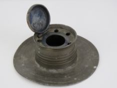 An Arts and crafts pewter inkwell of cap