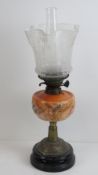 A 19th century oil lamp having brass bas
