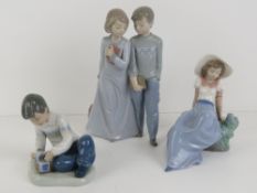Three assorted Nao figurines, 12-23cm.