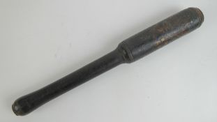 A Victorian truncheon having black groun
