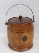 A c1930s oak ice bucket with swing handl
