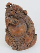 A carved bamboo Oriental deity figure st