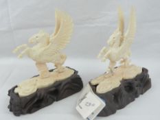 A pair of Pegusus like winged horses car