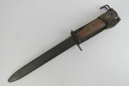 A Norwegian Krag bayonet with German marks on the hilt, converted by US to fit M1 Carbine,