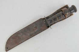 A WWII US K-BAR fighting knife with leather sheath.