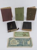 A set of Japanese soldiers pay books and technical manuals with 2 pieces of paper money and