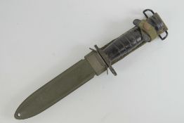 A WWII US M1 Carbine bayonet with scabbard.