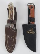 Two knives with scabbards; Joker and Gerber.