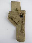 A WWII British Enfield canvas holster having broad arrow mark to back.