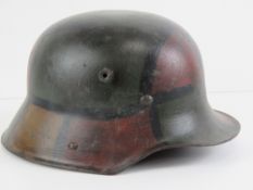 A WWI German M16 camo helmet, repainted.