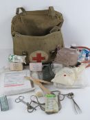 A WWII British First Aid Kit having canvas case and equipment, dated 1942.