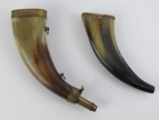 Two late 1800s horn powder flasks having brass fittings.