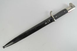 A German K98 parade bayonet having 25cm blade marked Alcoso Solingen, with scabbard.