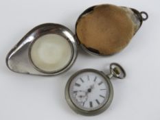 A vintage pocket watch having white enamel dial and rose metal hands,
