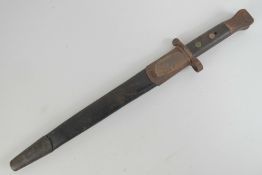 A long Lee Enfield bayonet marked indistinctly (Wilkinson Sword?) and having inspection marks to