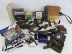 A quantity of assorted items including; casings, clips, link, medals, cleaning kits, pouches,