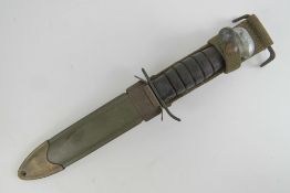 A WWII US M8 fighting knife with scabbard.