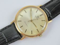 A vintage 9ct gold Omega wristwatch having silvered dial with yellow metal hands, hallmarked 375,