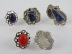 Five hardstone rings each stamped 925, size Q-R, including moonstone and lapis lazuli.