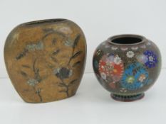 A heavy Oriental cast brass flask vase decorated with flowers in relief on a burnished gold ground,