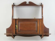 An Edwardian mahogany wall cabinet with shelf over, 72 x 65cm.